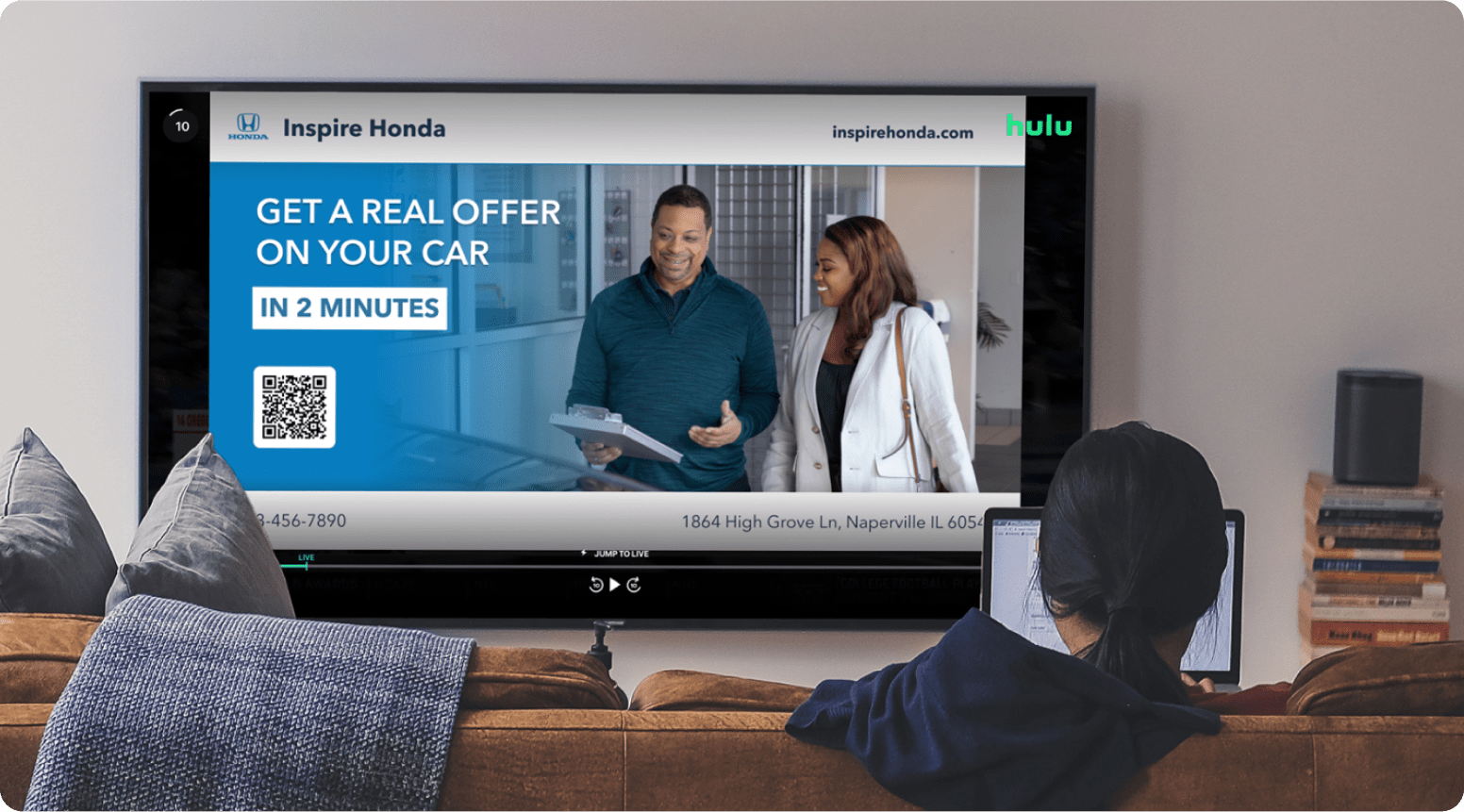 Dealership TV ad, 'get a real offer on your car' followed by a Accutrade QR code.