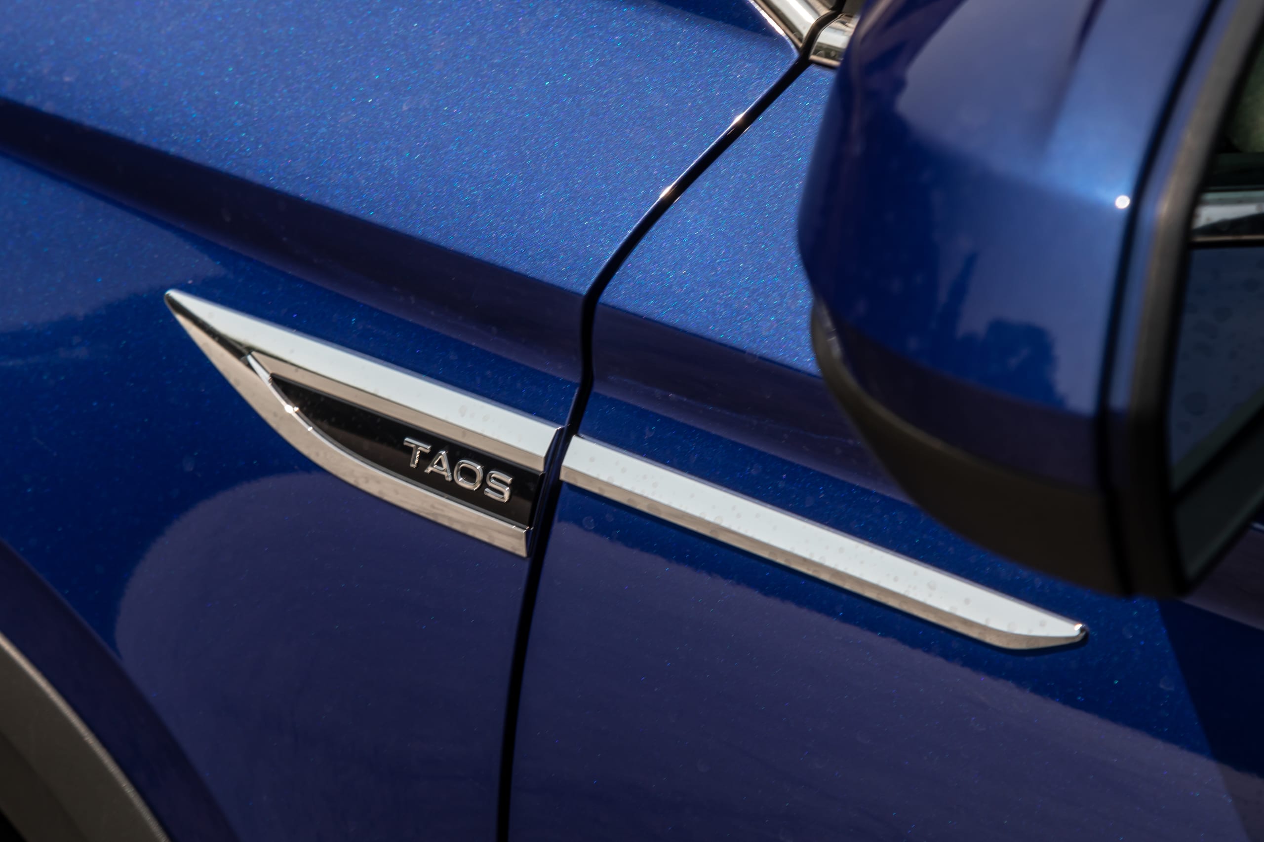 volkswagen taos 1 5t se 2023 08 exterior profile badge jpg? i=AA